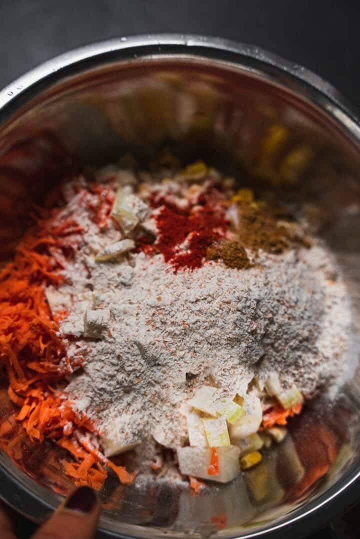 Sweet potato fritter ingredients in a mixing bowl