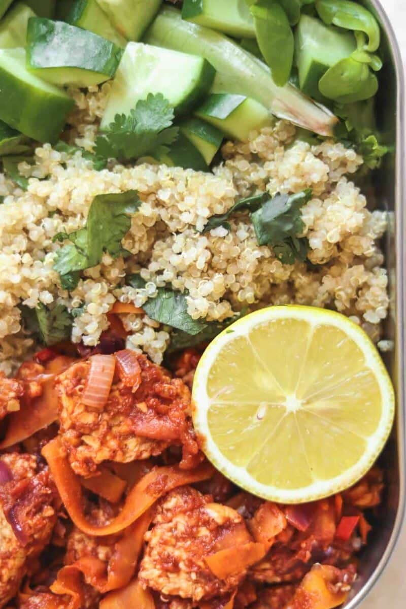 Vegan meal prep quinoa and tempeh in tomato sauce