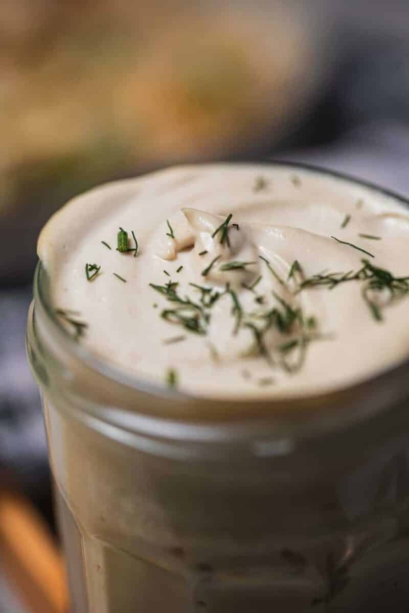 Vegan sour cream in a glass jar