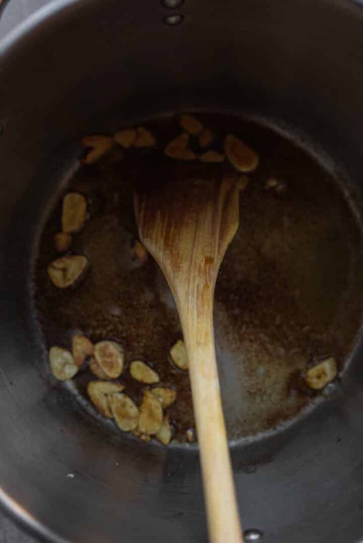 Toasted garlic in a saucepan