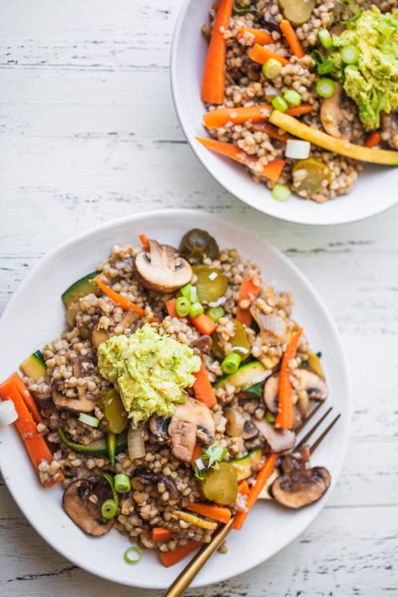 Two bowls of buckwheat with vegetables