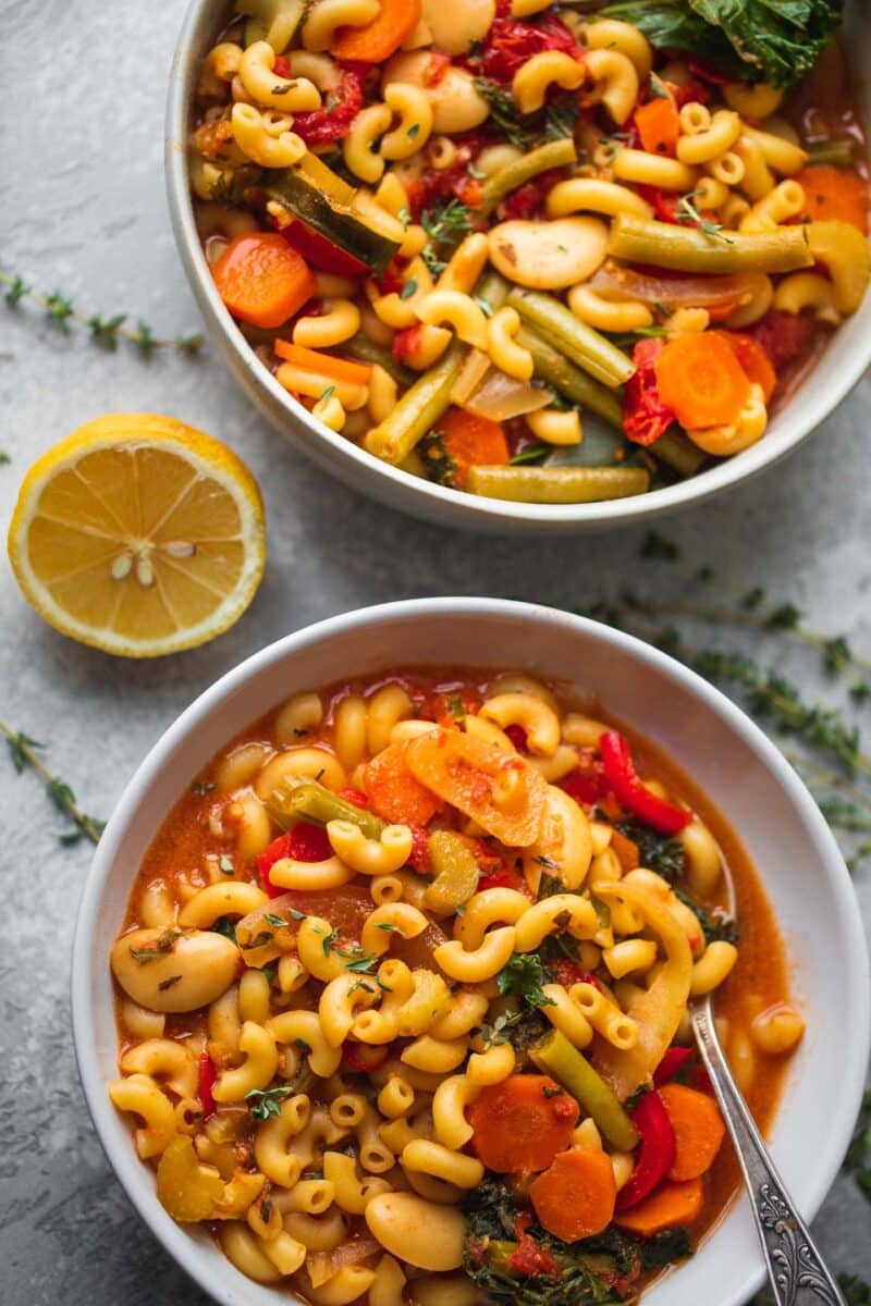 Two bowls of minestrone soup with beans and pasta