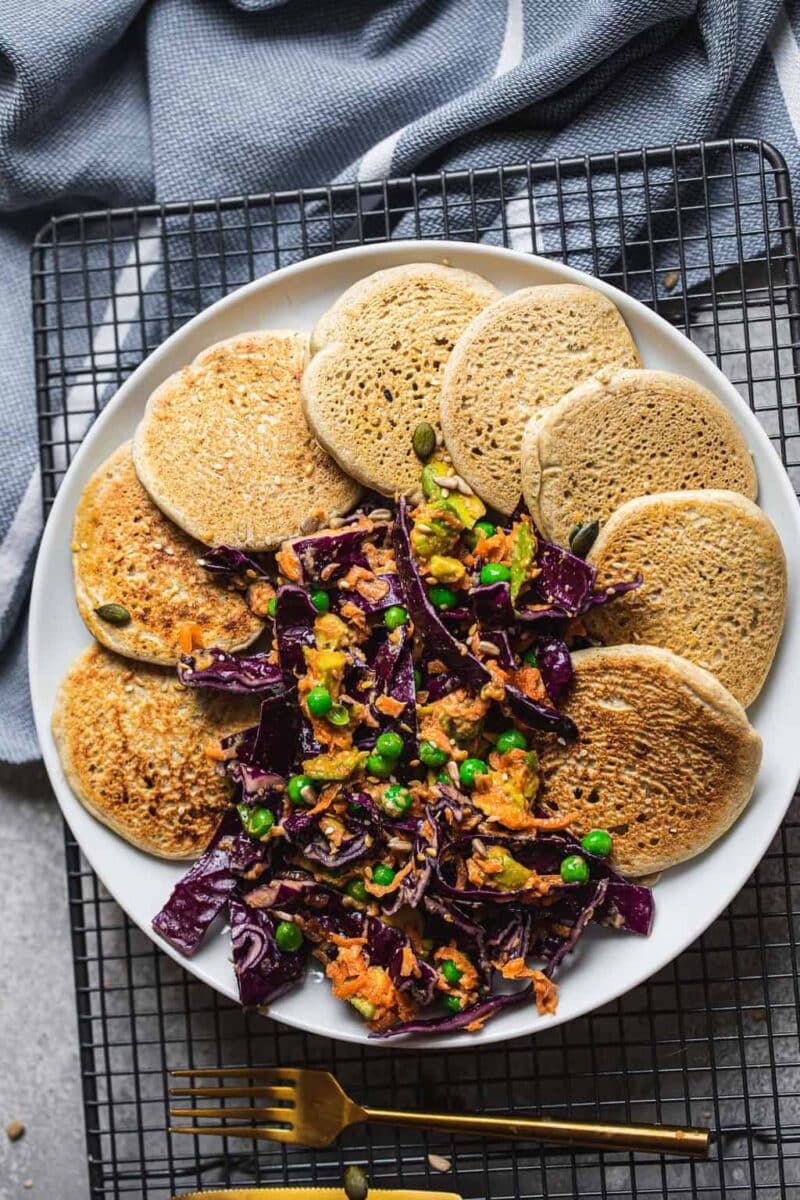 Plate of vegan pancakes with vegetables
