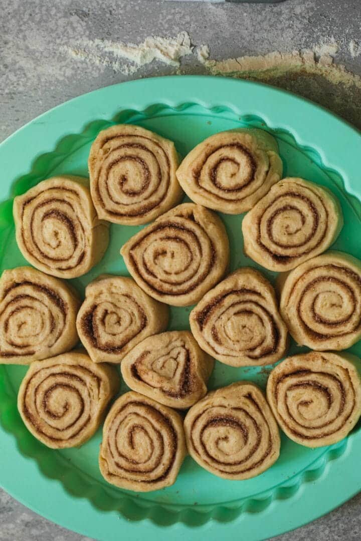 Vegan cinnamon rolls in a baking tray before baking