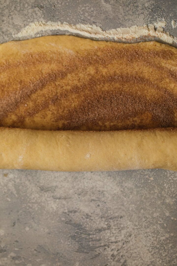 Vegan dough being rolled up