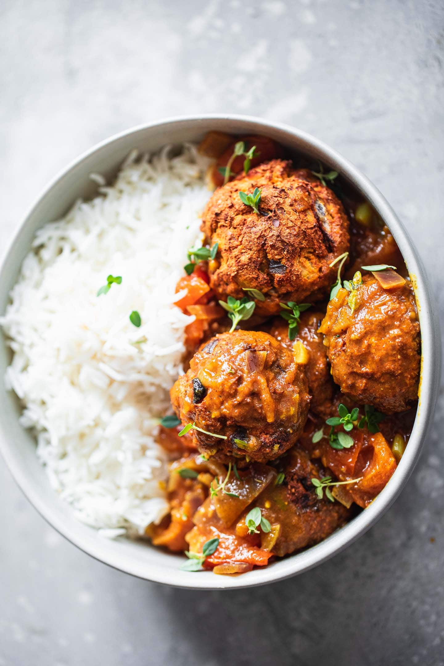 Vegan lentil meatballs with curry sauce and rice
