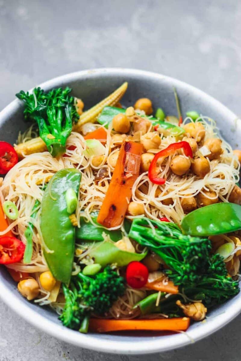 Bowl of vegan stir-fry with noodles chickpeas and vegetables