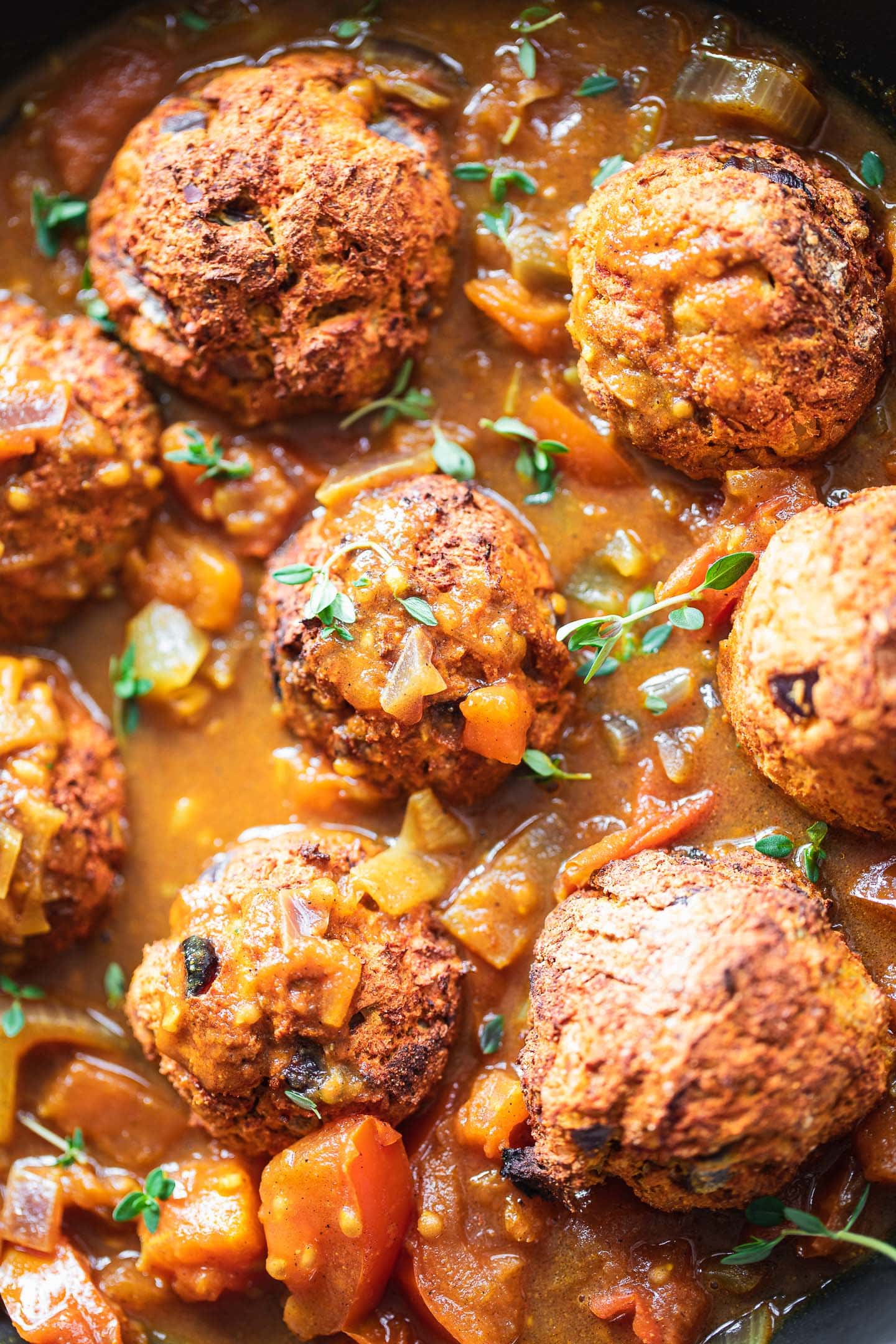 Vegan meatballs with curry sauce in a pan