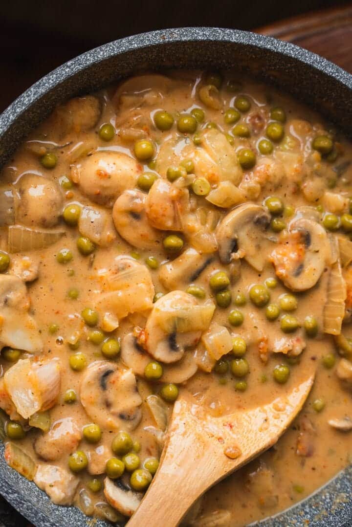 Vegan mushroom and pea sauce in a frying pan