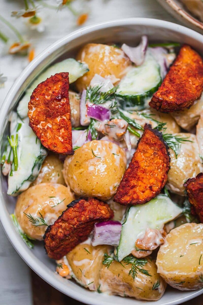 Closeup of a vegan potato salad with tempeh