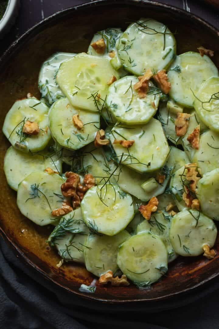 Vegan salad with cucumbers and walnuts