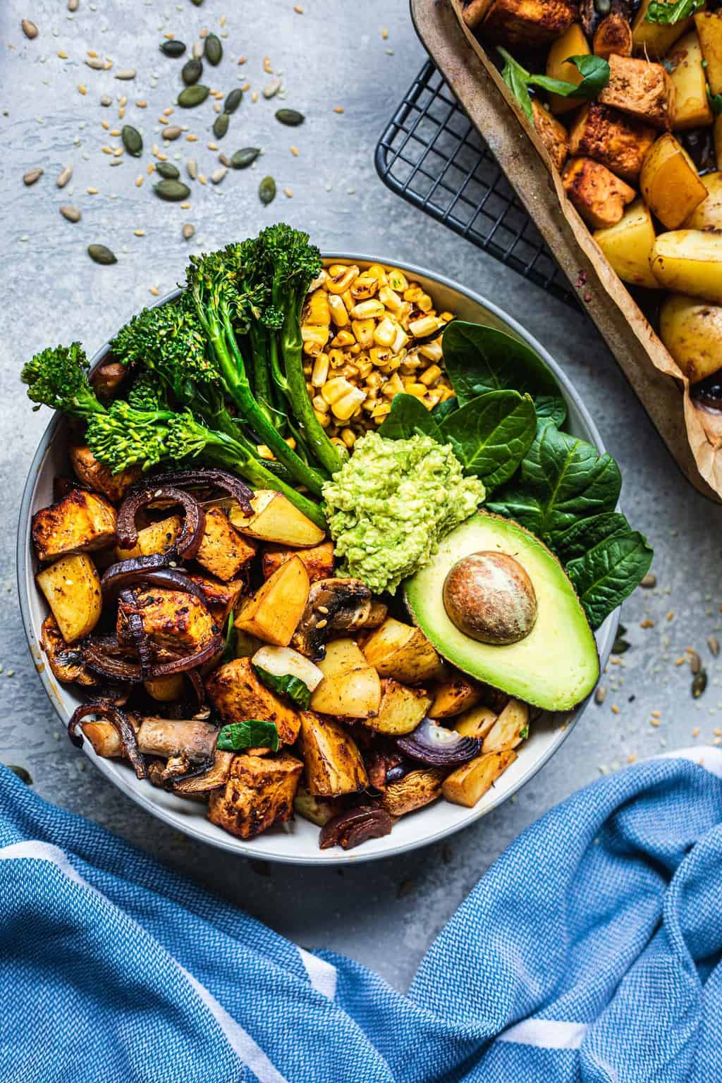 Bowl with sheet pan vegetables and avocado