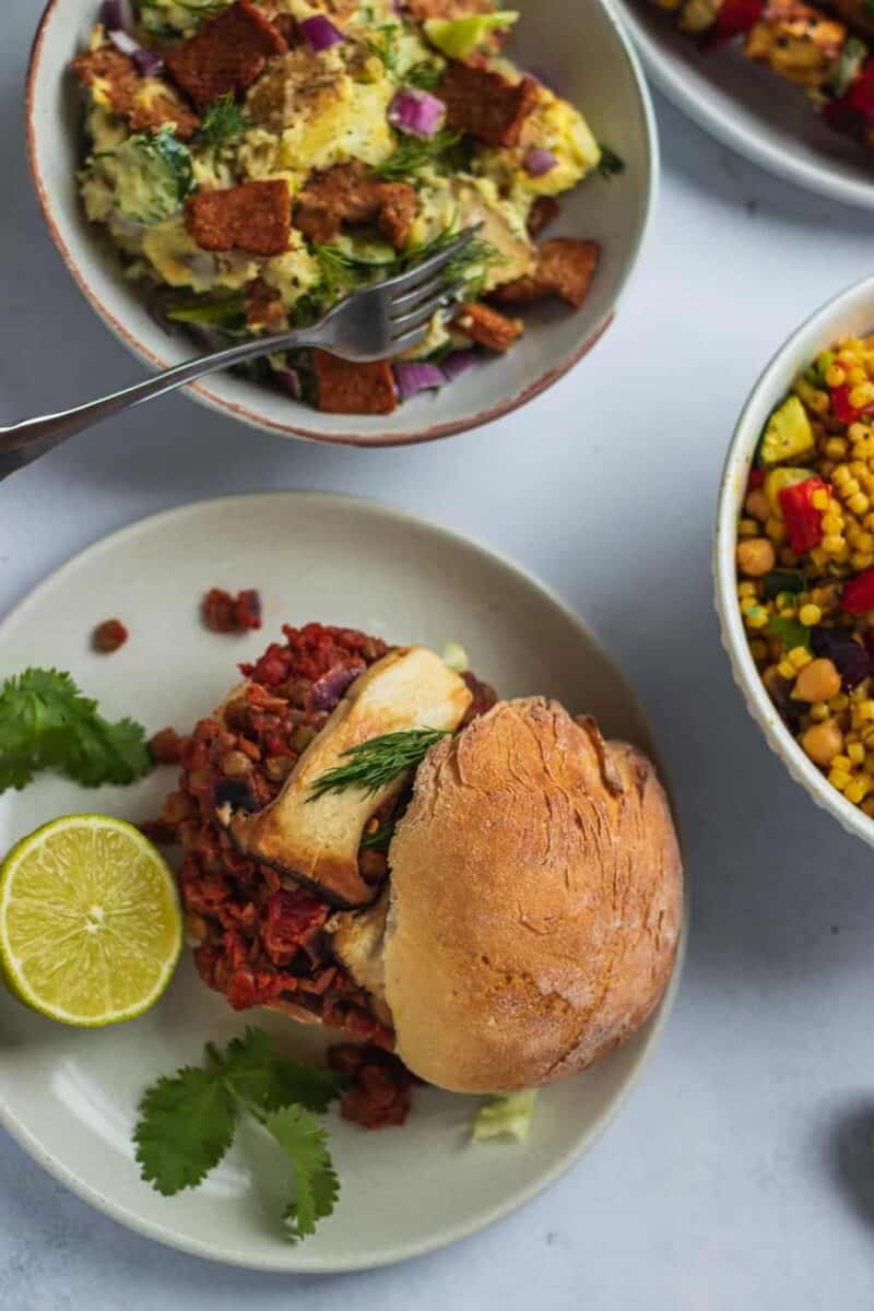 Vegan BBQ with burgers, potato salad and couscous