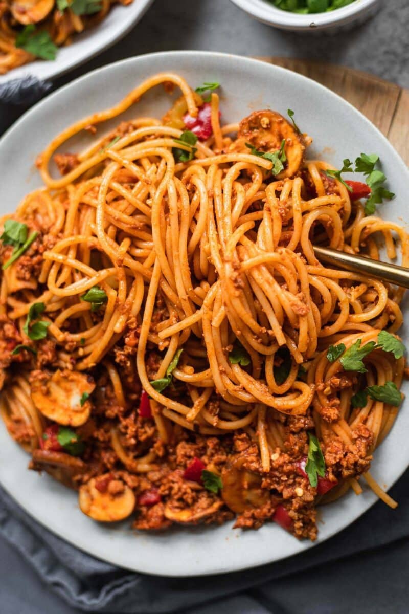 Vegan spaghetti dish with a tomato vegetable sauce