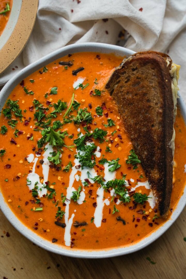 Vegan tomato soup with a grilled cheese sandwich