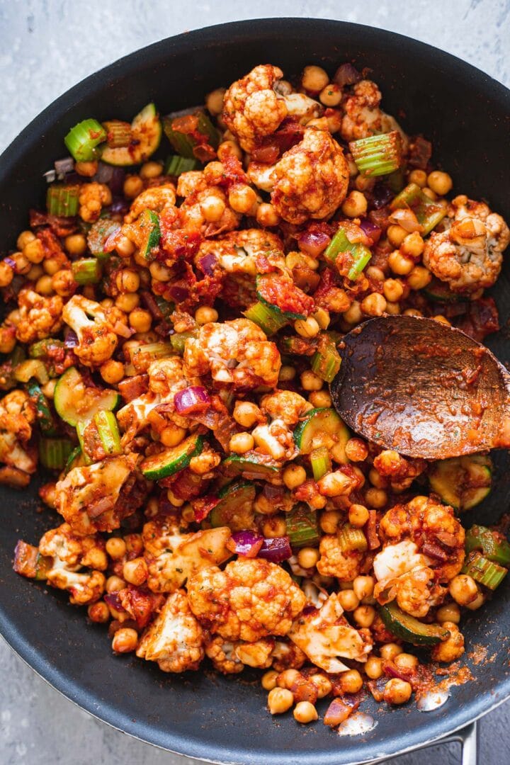 Vegetables and chickpeas in a frying pan