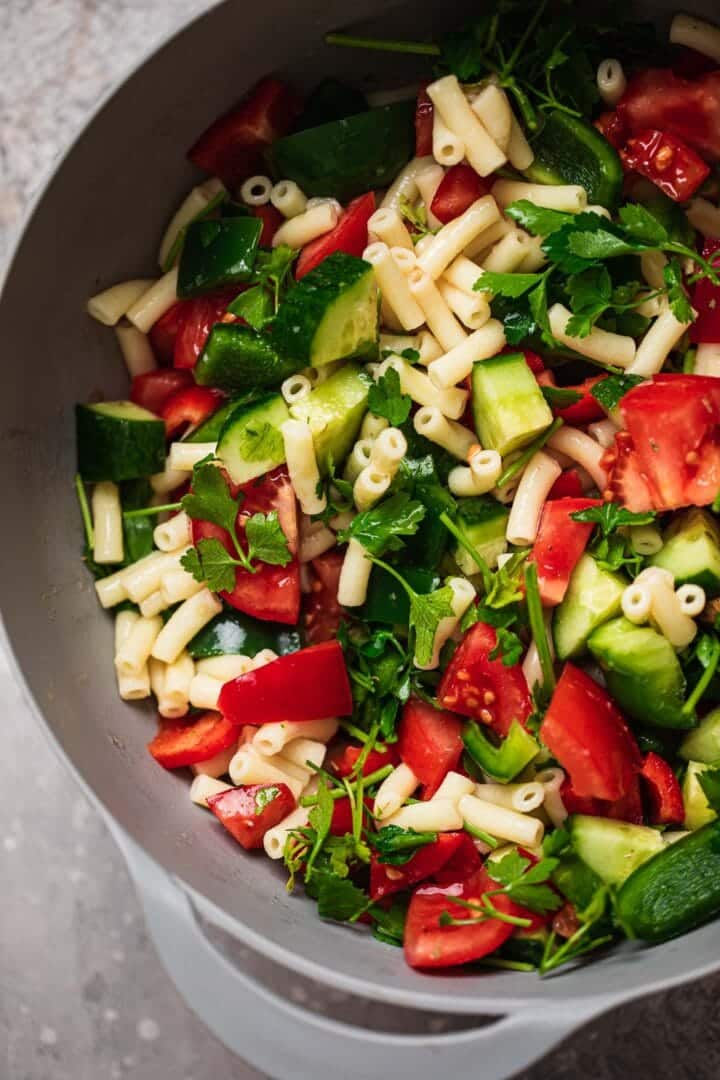 Vegetables and macaroni in a mixing bowl