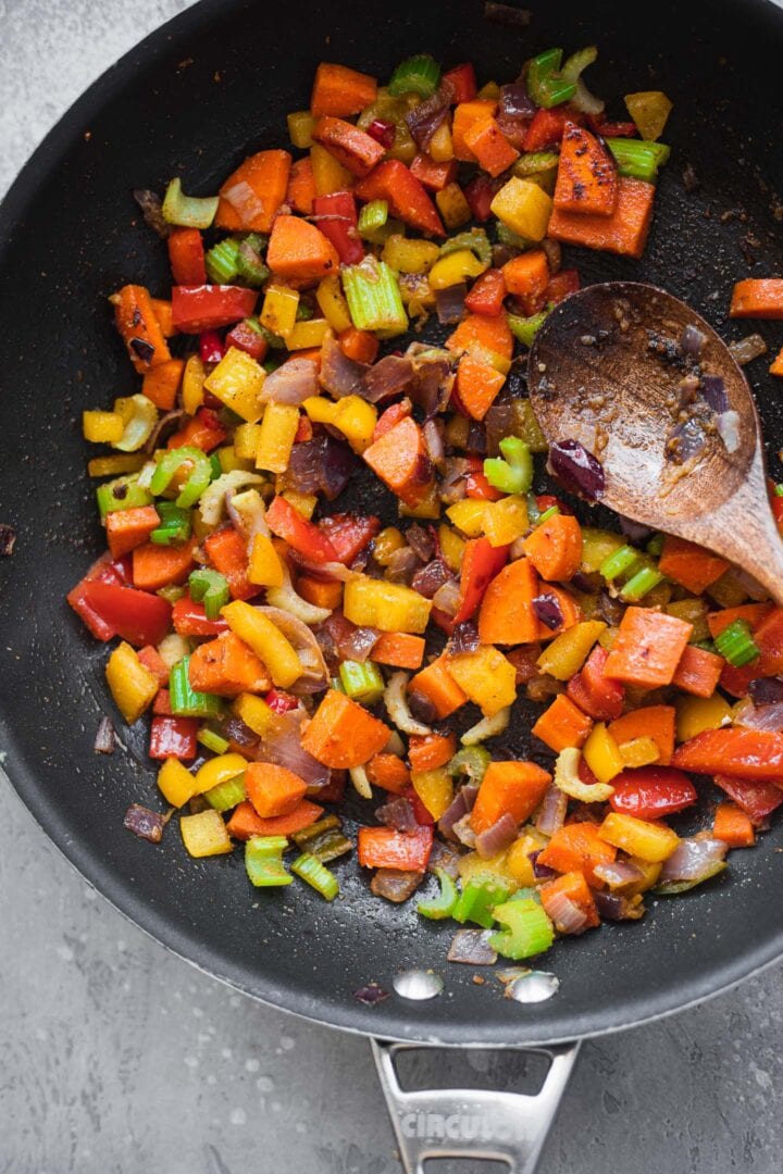 Vegetables and spices in a frying pan