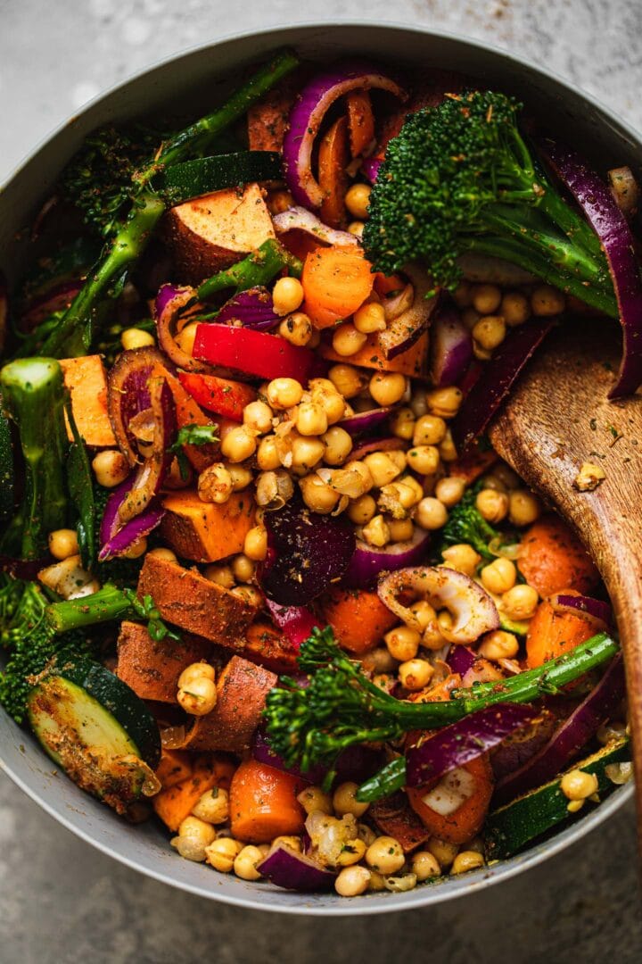 Vegetables, chickpeas and sweet potatoes in a mixing bowl