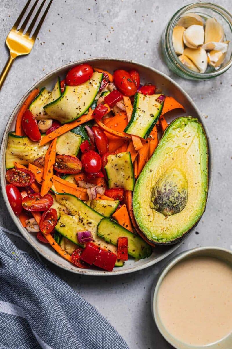 Bowl of salad with zucchini and sweet potato