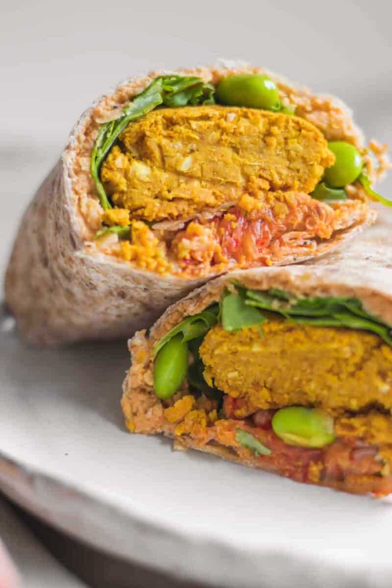 Vegan wraps with baked falafels, hummus and vegetables