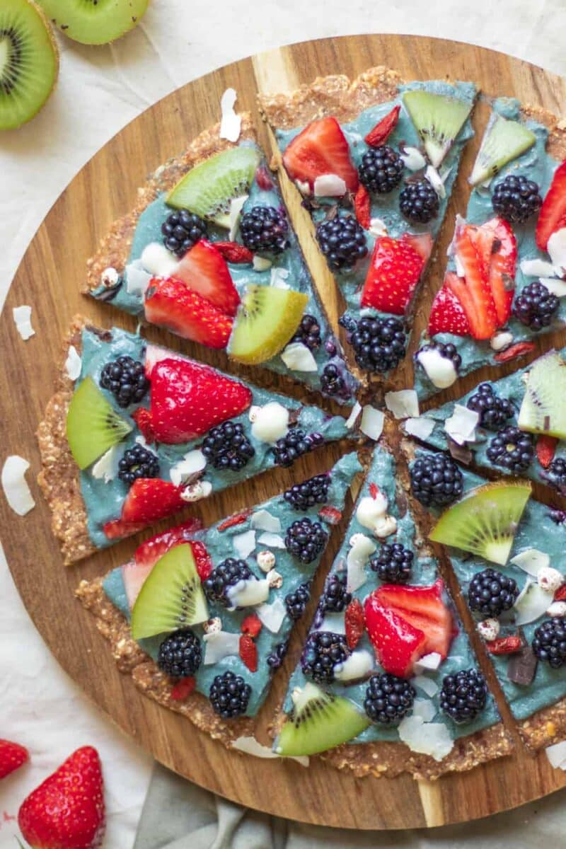 Vegan sweet dessert pizza with berries and yoghurt sauce 