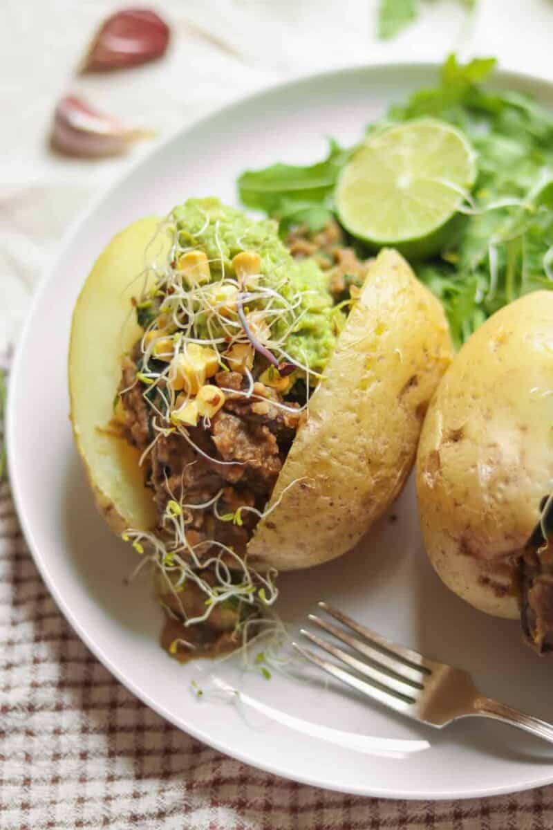 Vegan lunch baked potatoes with lentils, avocado and sweetcorn
