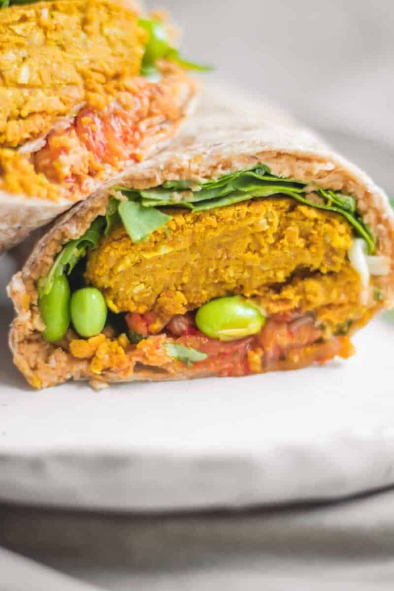 Healthy vegan baked falafel wraps with edamame and hummus