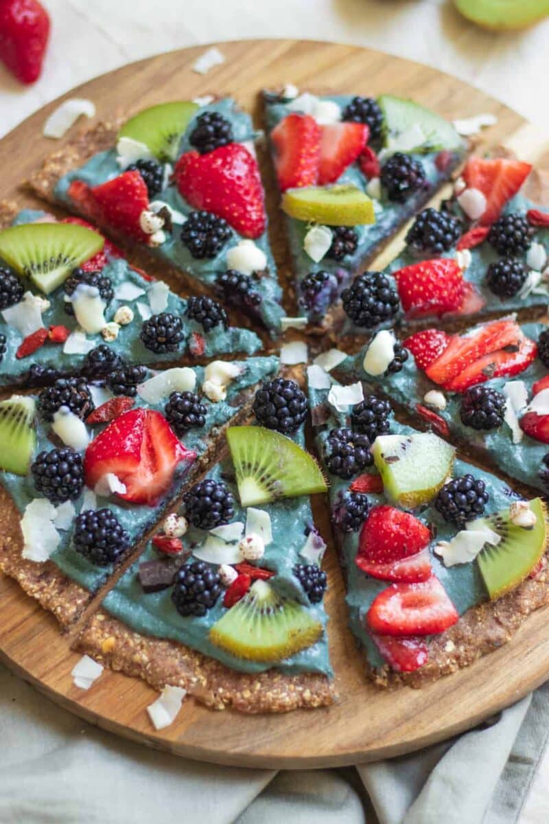 Vegan dessert pizza with fresh berries and blackberry yoghurt sauce