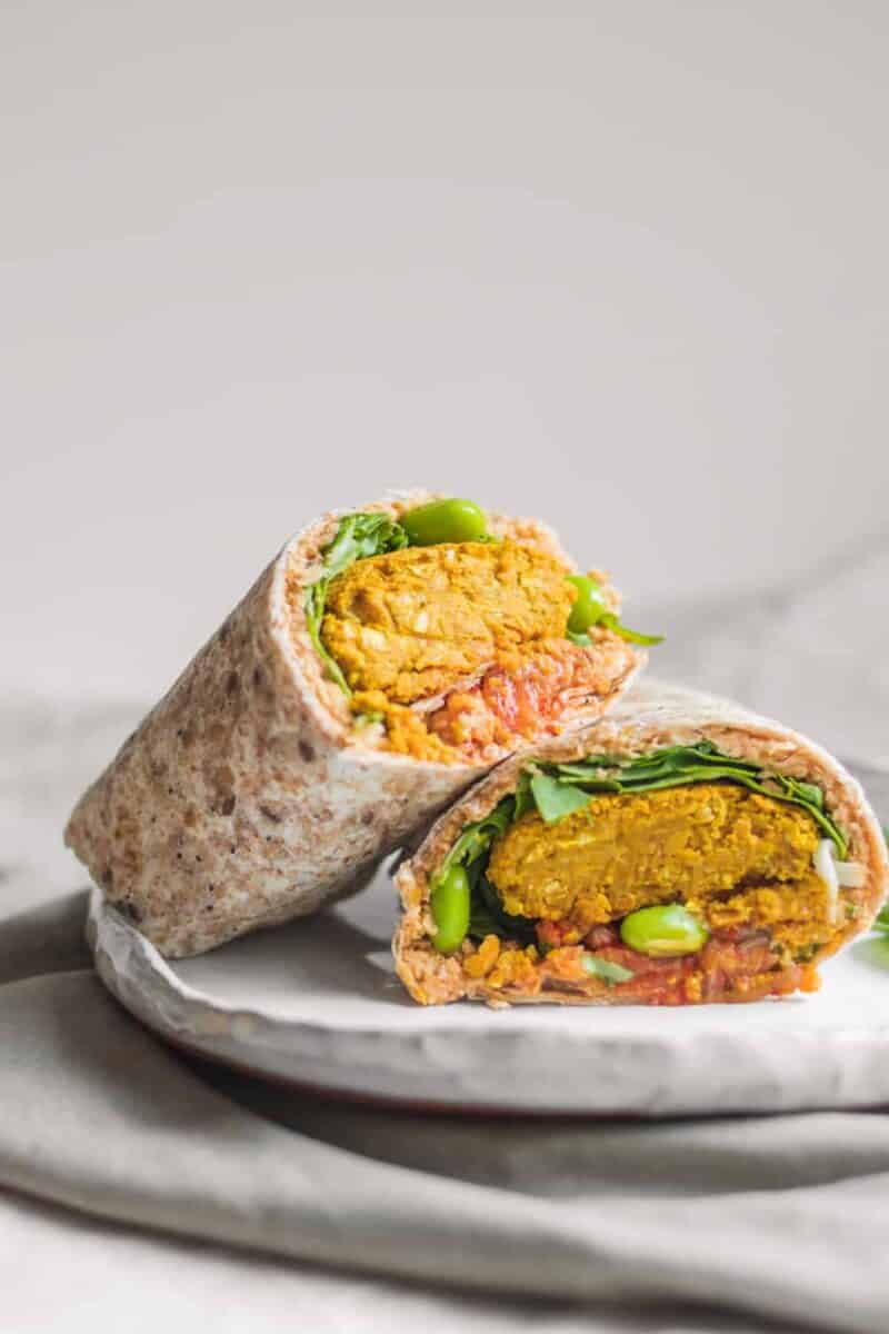 Vegan baked falafel wraps with hummus and edamame