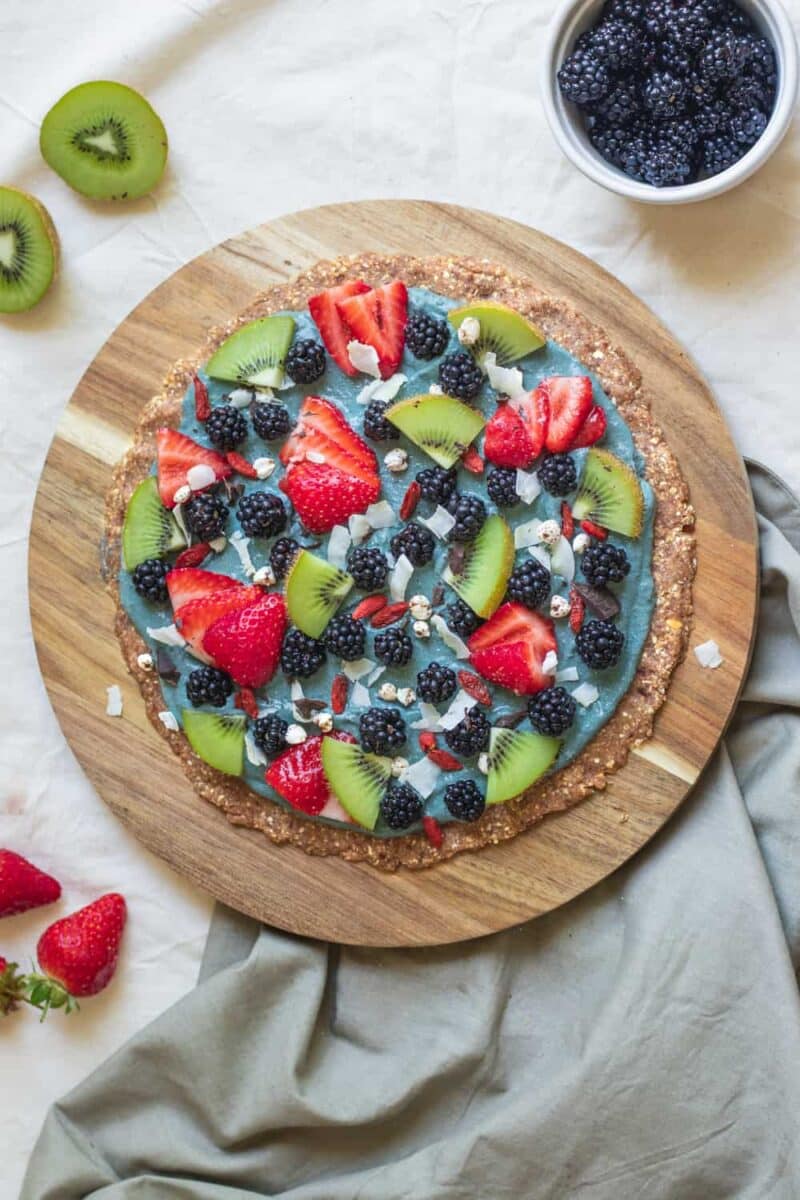 Sweet pizza with berries and blackberry sauce that is vegan and gluten-free