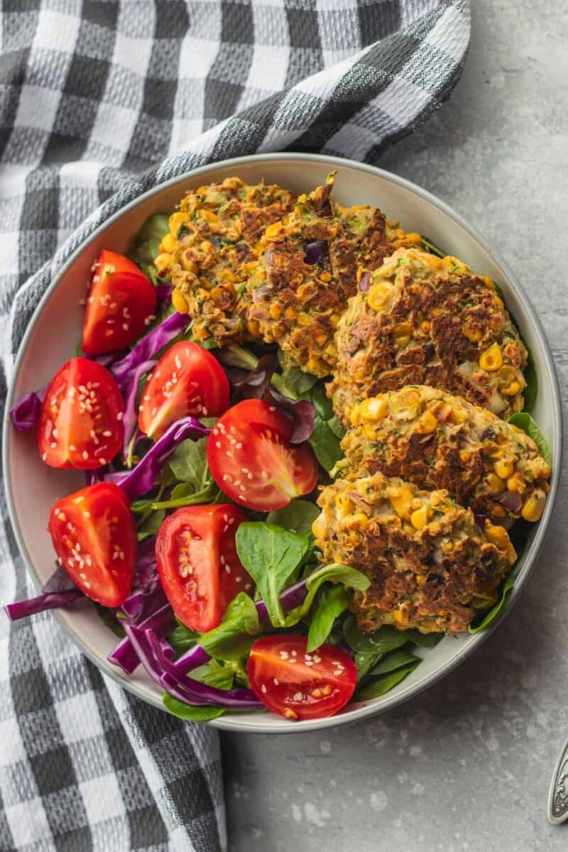 Healthy vegan zucchini fritters with salad