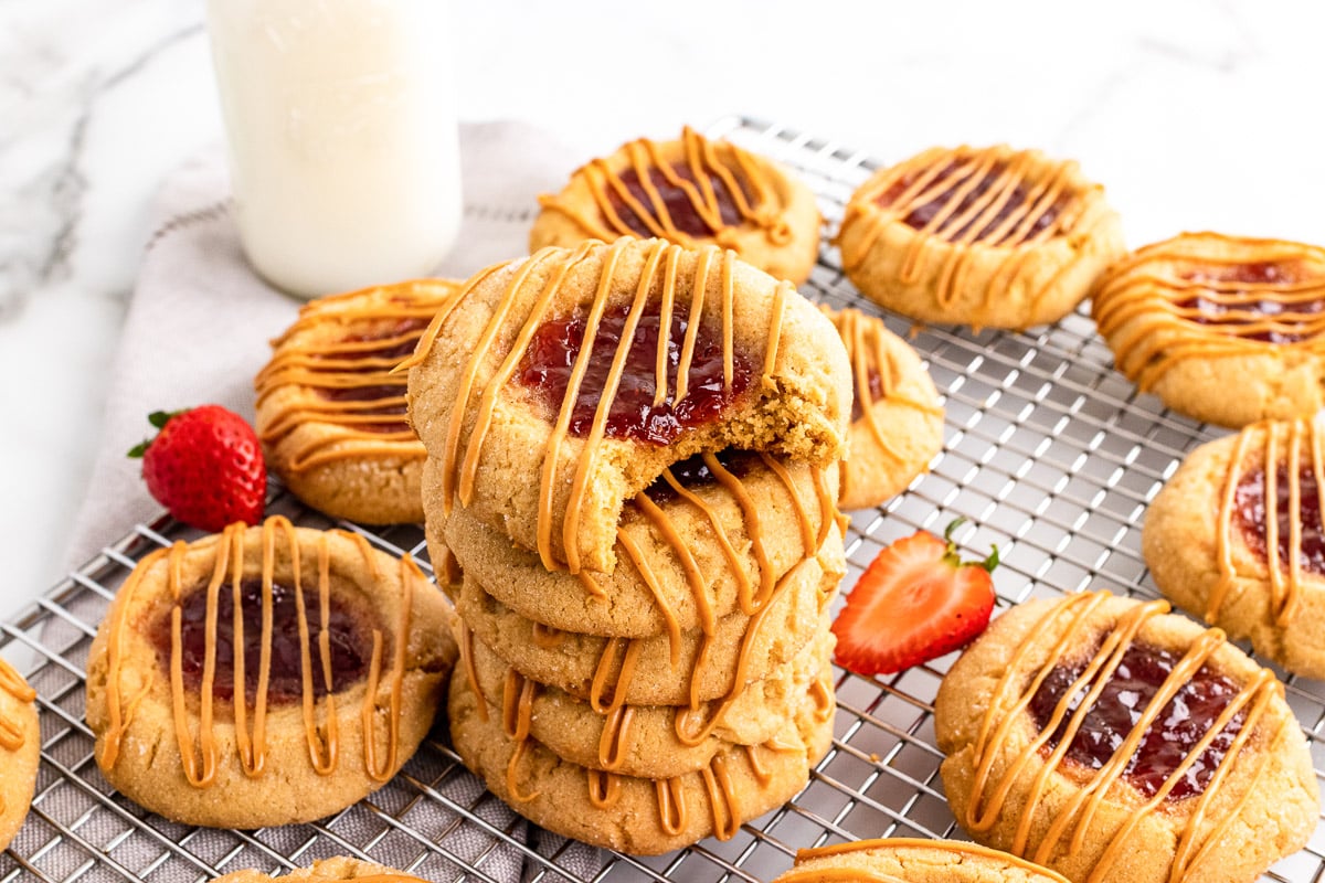 top view stack of peanut butter and jelly cookies on cooling rack