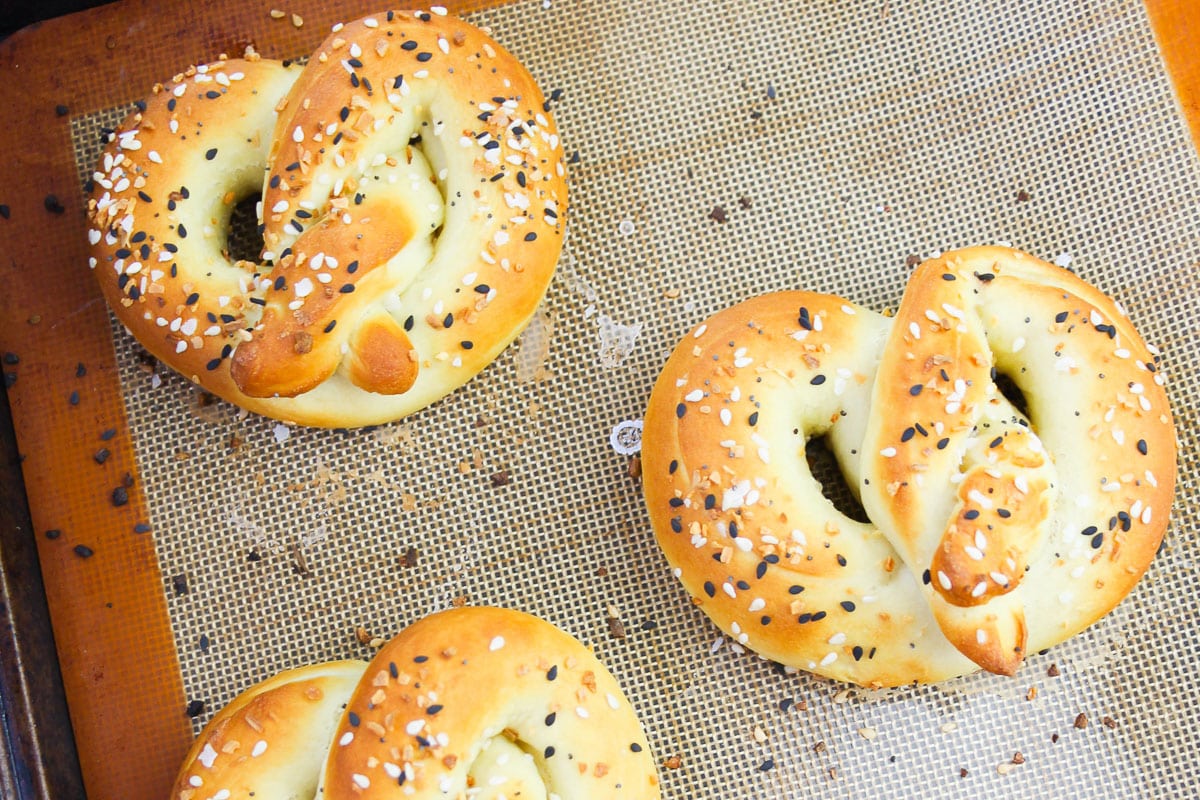 close up homemade soft pretzels on baking sheet