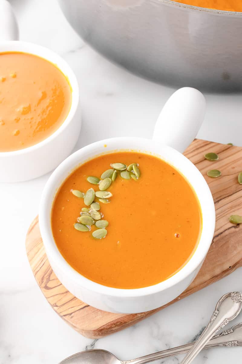 pumpkin curry soup in a white bowl