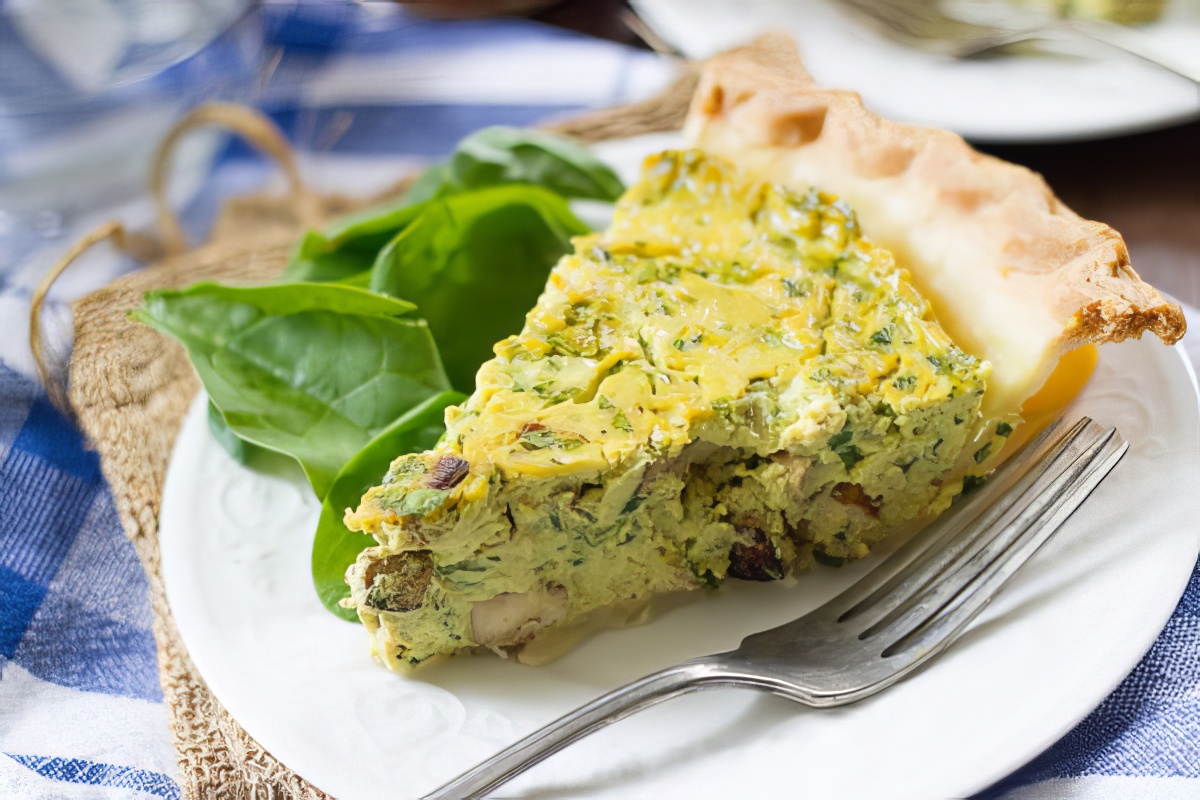 slice of vegan quiche on a serving plate