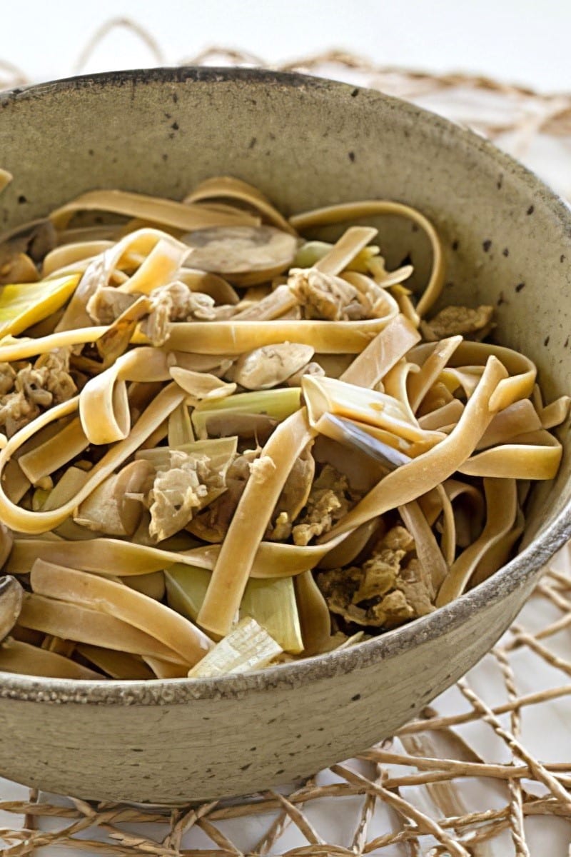 close up of wild mushroom fettucine with vegan sausage