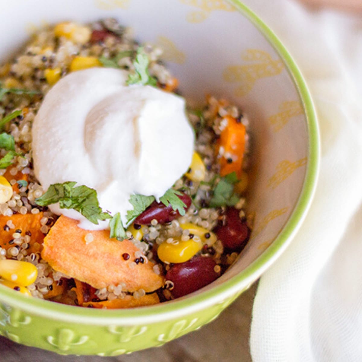 close up of a sweet potato quinoa bowl being served