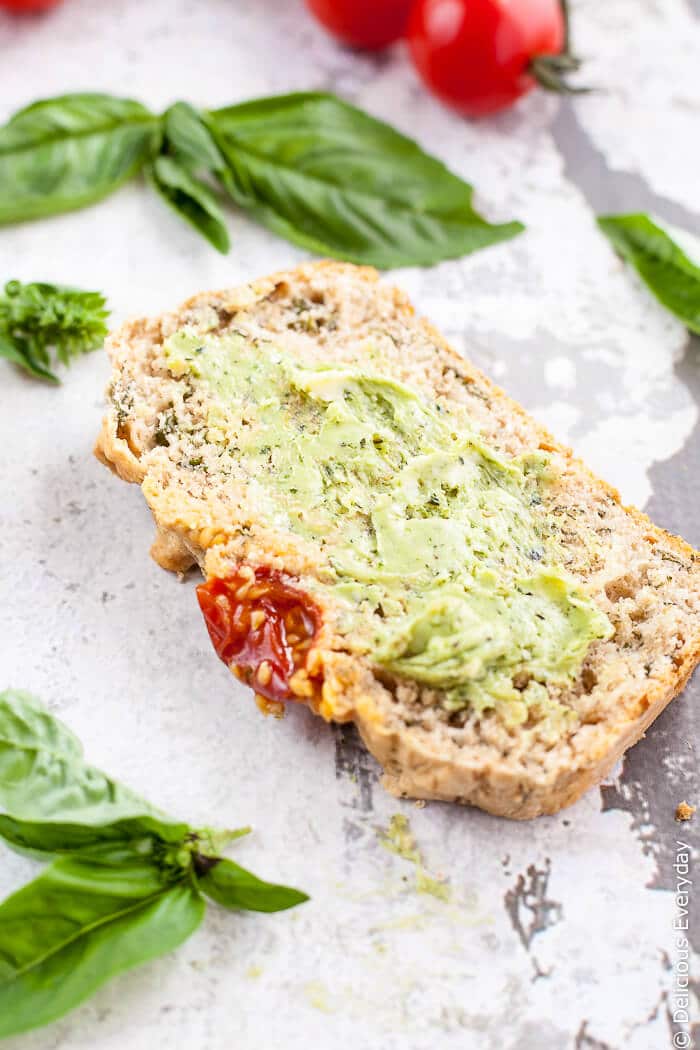 Super Easy Beer Bread with Basil and Tomatoes - All you need is a handful of ingredients, and an hour to make this super easy beer bread with basil and tomato. Serve warm slathered with butter! | Get the recipe at deliciouseveryday.com