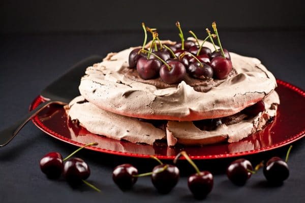 black forest pavlova topped with cherries
