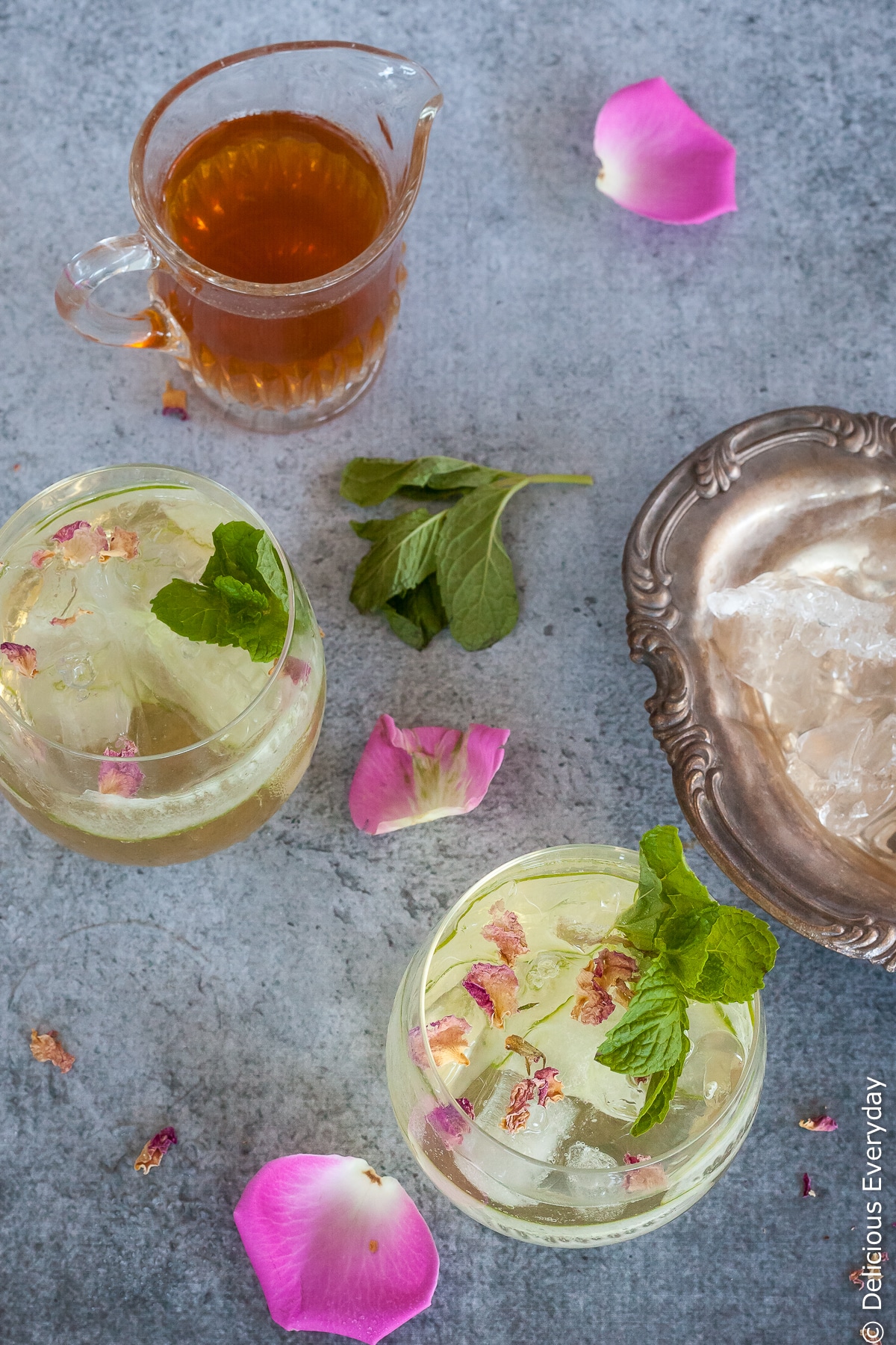 This delicately perfumed light, fizzy Rose and Cucumber Collins cocktail is a perfect pre-dinner sipper. With refreshing cucumber and a homemade rosewater syrup it is the perfect compliment to aromatic gin.