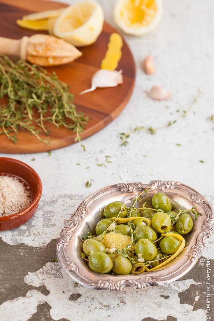 Plump green Sicilian olives are marinated in lemon zest and juice, garlic and thyme for a totally addictive and delicious treat. | Click for the recipe 
