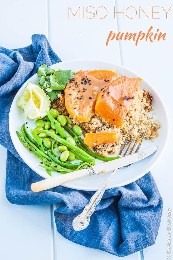 Miso glazed pumpkin being served over quinoa