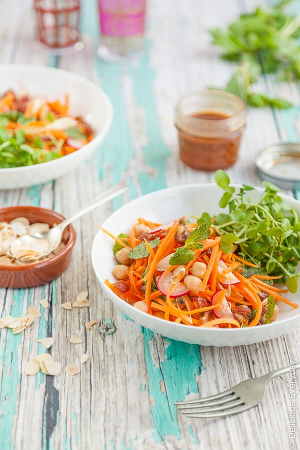 This vegetarian Moroccan carrot salad is divine mix of spices, honey dates and chickpeas. Top with toasted flaked almonds.