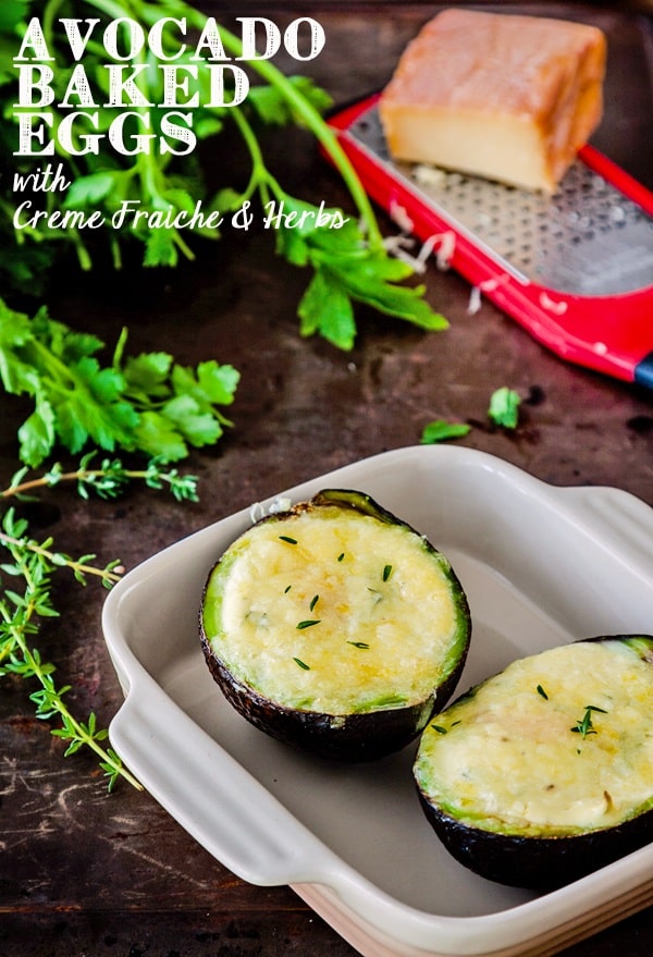 Avocado baked eggs with creme fraiche and herbs recipe - forget simply baking an egg in an avocado and go with this dressed up version with creme fraiche, herbs and cheese! | deliciouseveryday.com #vegetarian #breakfast