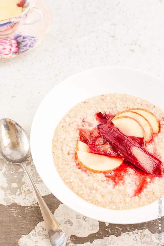 Maple Roasted Rhubarb Buckwheat Porridge Recipe - Ruby hued rhubarb is roasted in maple syrup until soft and luscious and served on a bed of apple buckwheat porridge for a healthy and satisfying way to start your day. | click for the recipe