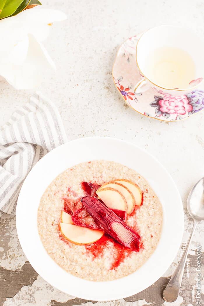 Maple Roasted Rhubarb Buckwheat Porridge Recipe - Ruby hued rhubarb is roasted in maple syrup until soft and luscious and served on a bed of apple buckwheat porridge for a healthy and satisfying way to start your day. | click for the recipe