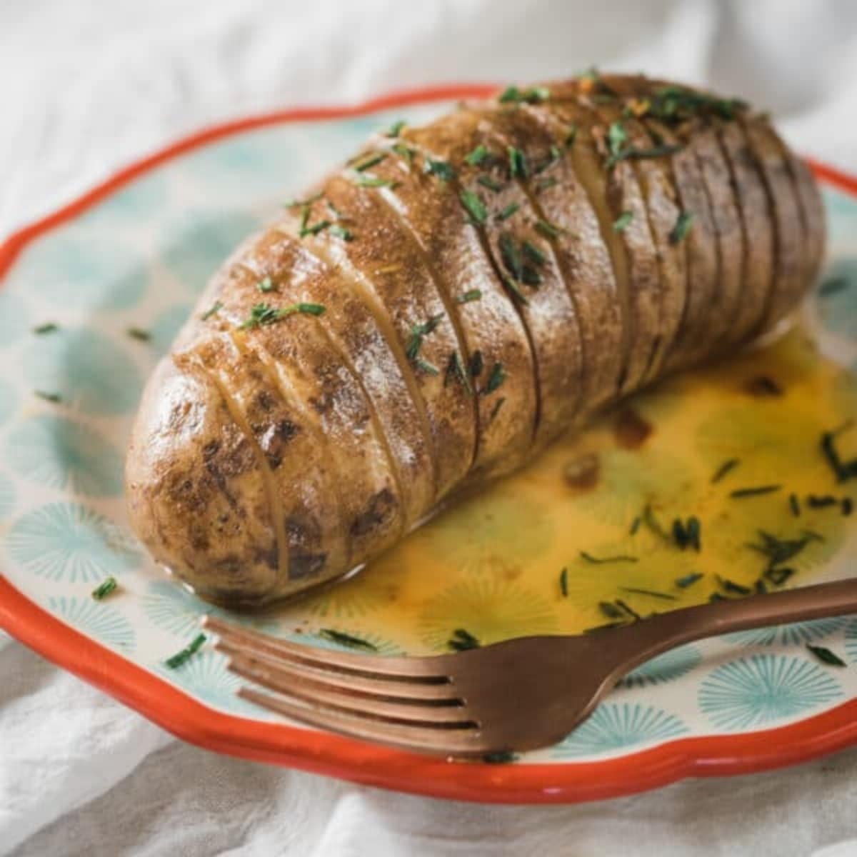 Slow Cooker Hasselback Potatoes with Honey-Sriracha Butter