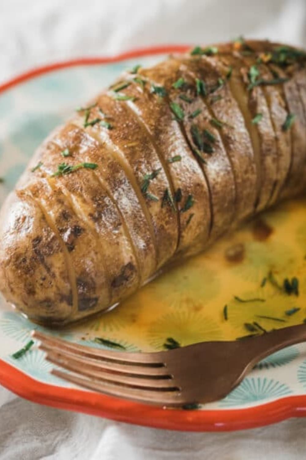 Slow Cooker Hasselback Potatoes with Honey-Sriracha Butter