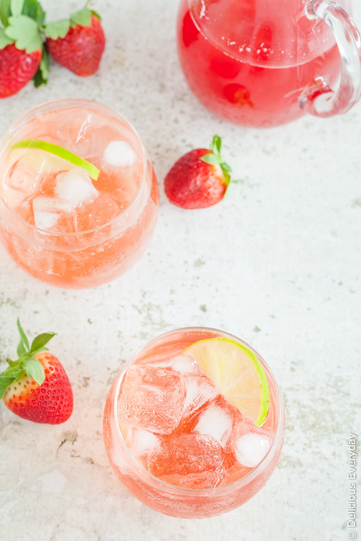 A beautiful homemade simple syrup (or cordial) made from fresh strawberries, rhubarb and lime. Add this gorgeous strawberry, lime and rhubarb syrup to sparkling water for a wonderful refreshing drink which also works wonderfully with a splash of gin! | Click for the recipe